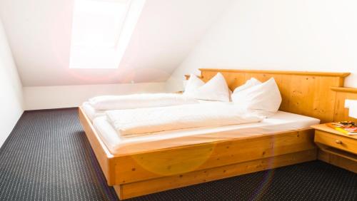 Un pat sau paturi într-o cameră la Cityhouse Apartments Schladming