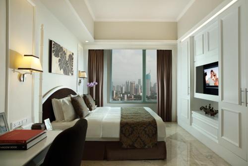 A television and/or entertainment centre at Ascott Jakarta