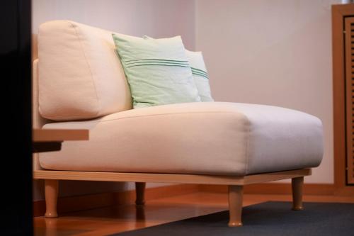 a chair with a pillow on top of it at Hotel Goldener Karpfen OHG in Fulda