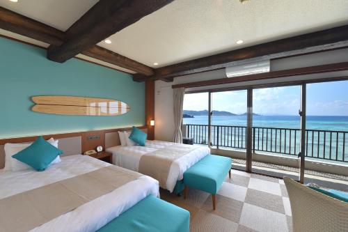 Voodi või voodid majutusasutuse Ishigaki Seaside Hotel toas