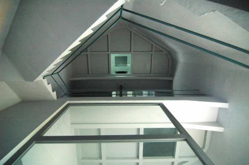 a glass shelf in a room with a ceiling at Art Tower in Vratimov