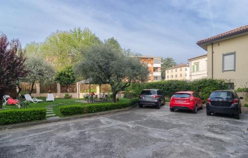 a group of cars parked in a parking lot at Il Giardino Del Pettirosso in Lucca