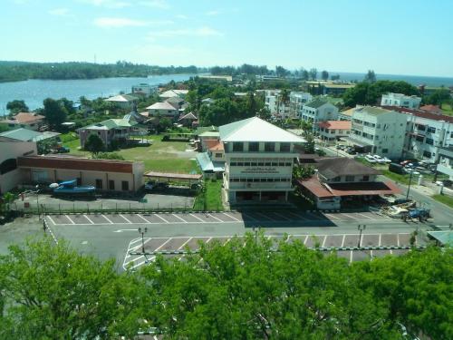 an aerial view of a city with a body of water at Keoja Hotel in Kuala Belait