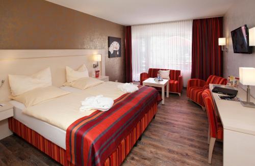 Cama ou camas em um quarto em Ringhotel Posthotel Usseln