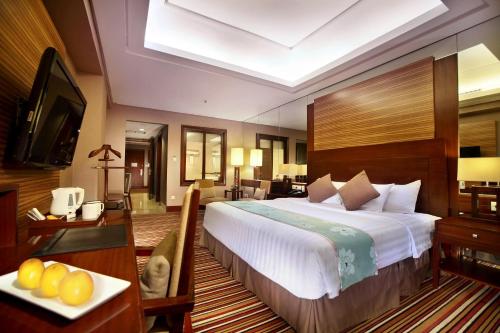 Cama ou camas em um quarto em Aston Samarinda Hotel and Convention Center