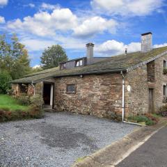 Farmhouse situated at the edge of the woods