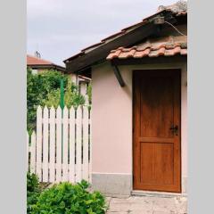 Cute Little House with a White Picket Fence