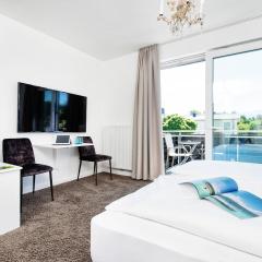 Hotel 24 Checkin Velden - Moderne Zimmer im Zentrum