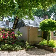 Beautiful house with a fireplace in a holiday park in the woods