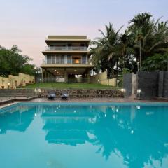 StayVista's Rivulet Waters - Lakefront Villa with Infinity Pool, Jacuzzi, Lawn, and Rustic Gazebo