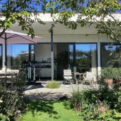 Cozy forest villa on the water near Harderwijk