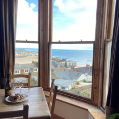 THE STONES a beautifully presented PRIVATE APARTMENT with far reaching VIEWS Over ST IVES HARBOUR and BAY and FREE ONSITE PARKING for LARGER GROUPS book along with our Connecting TWO SISTER APARTMENTS