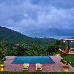 Waterfront Villa with Infinity Pool & BBQ Grill at Pune by StayVista