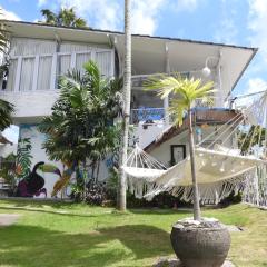 Surga Tropical Suites