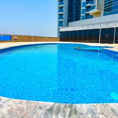 Luxury Home seafront view 1BHK pool gym wifi