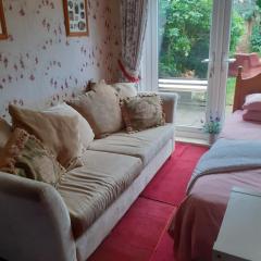 2 single beds for 2 guest, large room, Sofa, netflix, garden view, patio & seating