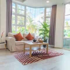 Cozy 1BR apartment by beach - partial ocean view