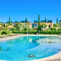 Green building-residence with swimming-pool immersed in the Tuscan countryside, elegant cottages with air conditioning and private outdoor space