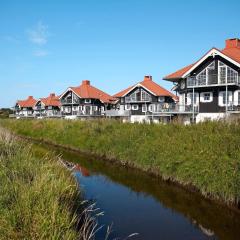 8 person holiday home on a holiday park in Bogense