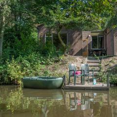 Restyled, waterfront bungalow with rowing boat, in a holiday park