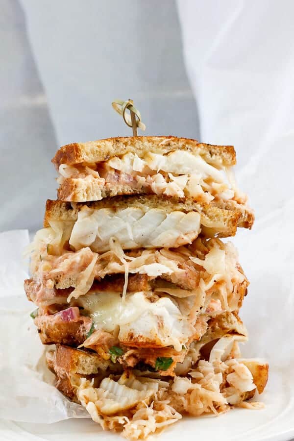 Multi-layer cod reuben sandwich.