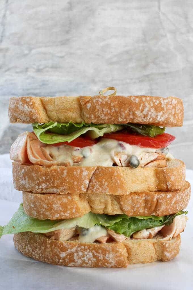 Two Easy Salmon Sandwiches with Dijon Sauce, stacked on top of one another.