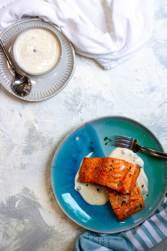 Air Fried Salmon on a plate with Yogurt sauce