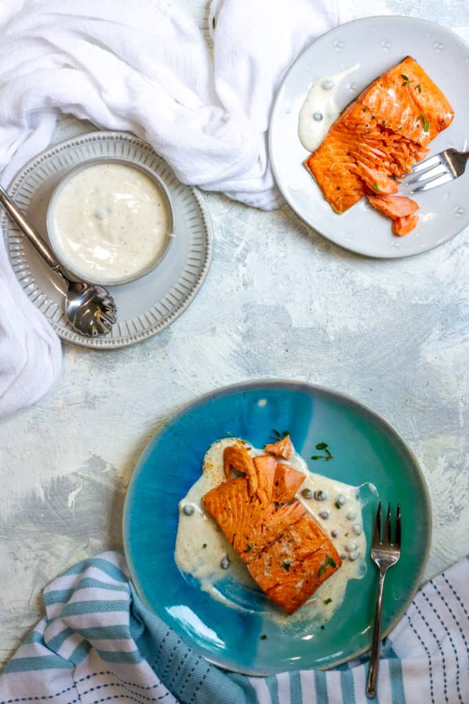 Air Fried Salmon on a plate with Yogurt sauce