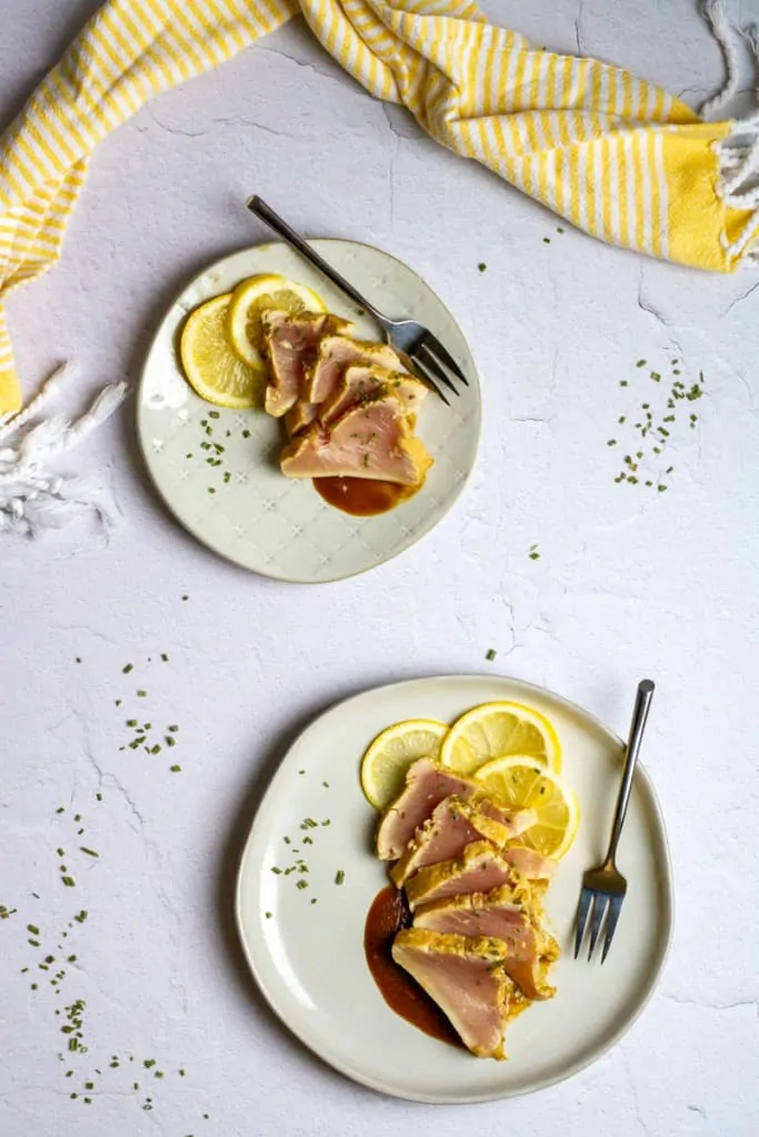 Seared albacore tuna slices on plates