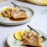 Seared albacore tuna slices on plates