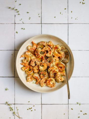 spot prawn recipe served with butter sauce in serving bowl.