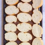 Bread arranged on a baking sheet.