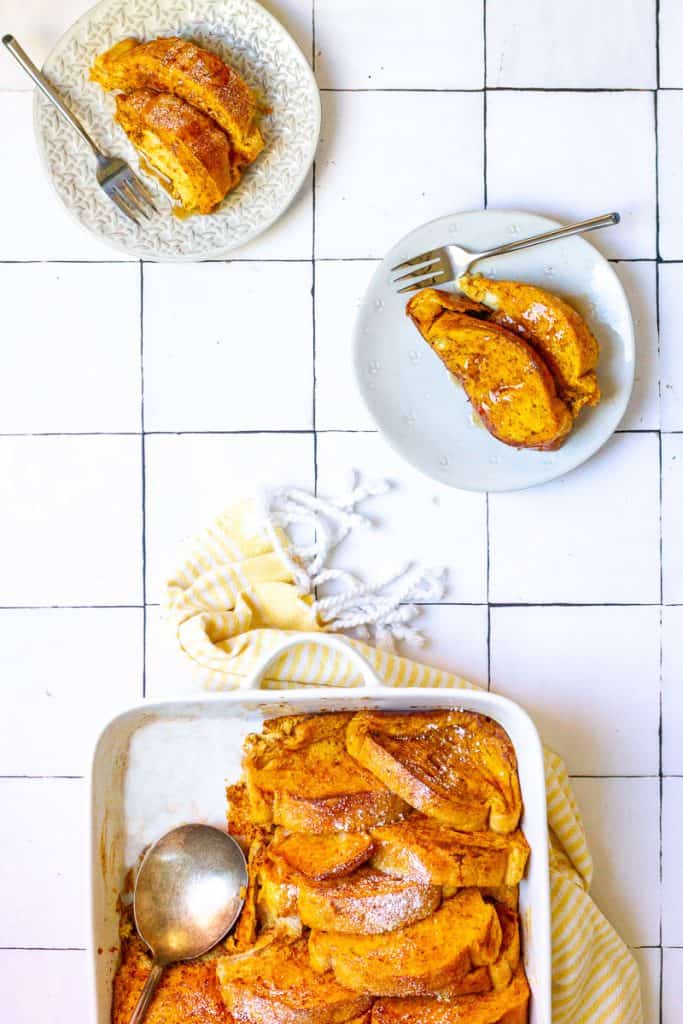 pumpkin french toast bake in a casserole dish and on plates.