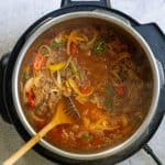 Adding the Beer to the Venison Chili.