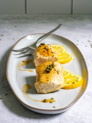 pan-seared striped bass on a serving tray.