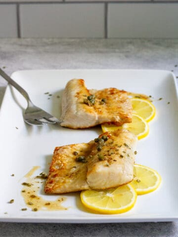 pan-seared walleye on a serving tray.