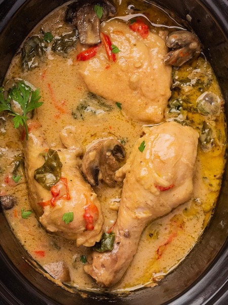 Creamy Chicken and Mushrooms in a creamy sauce in a Crock Pot.