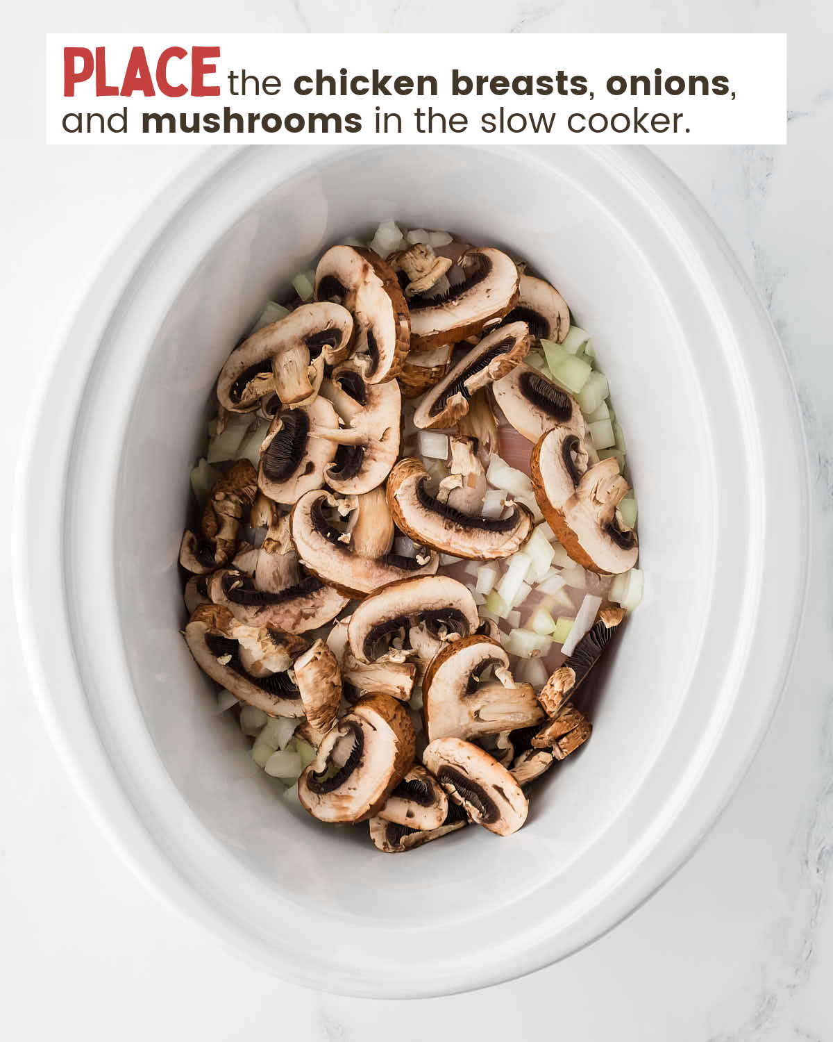 Top view looking into a slow cooker filled with mushrooms, onions, and chicken with instructions in a text box.