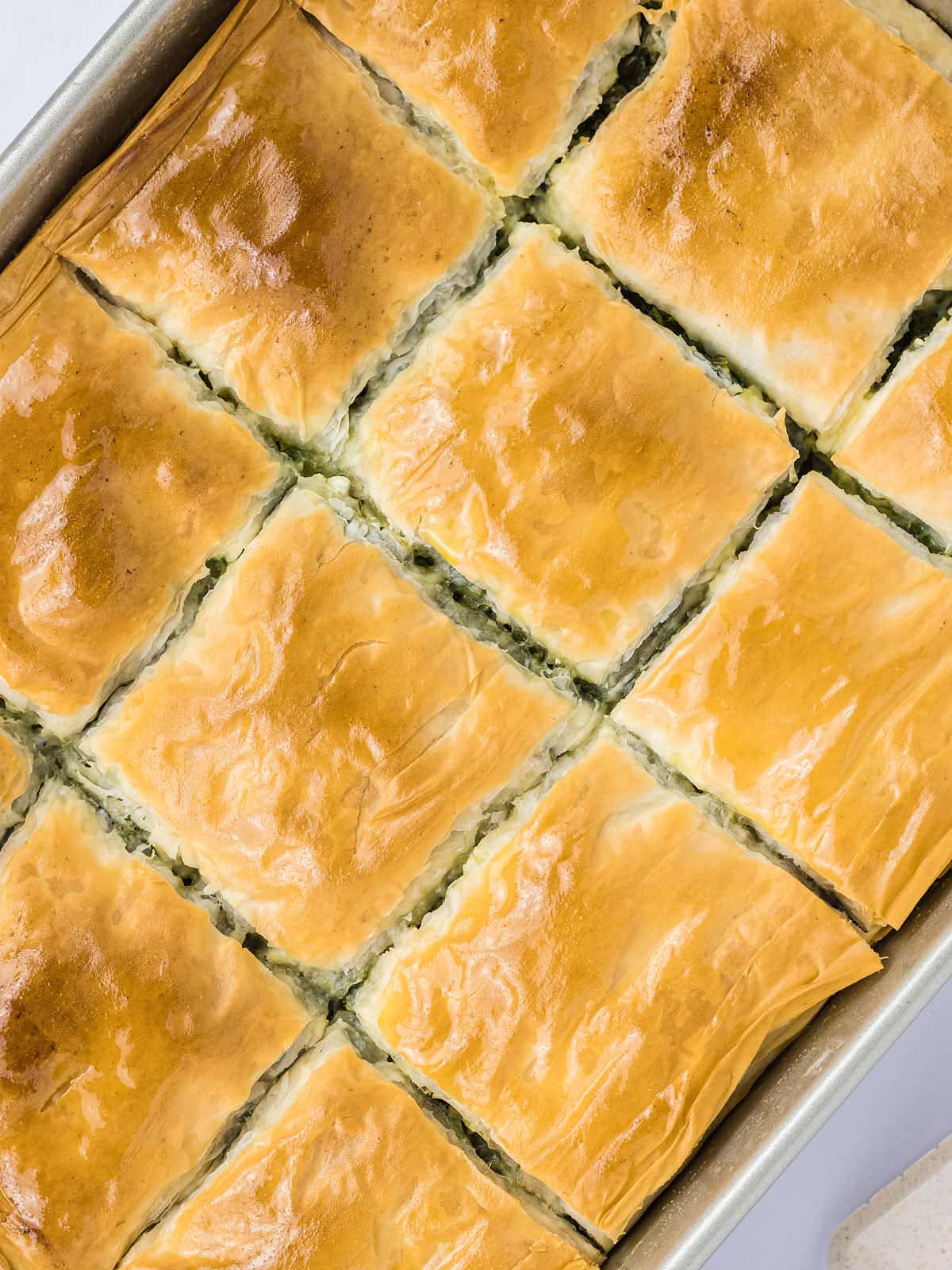 Topdown view of Spanakopita in a baking sheet.