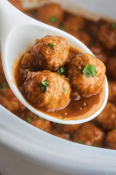 A spoonful of Crockpot Meatballs and Gravy.