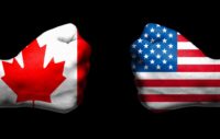 Fists facing each other with Canadian and U.S. flags overlayed