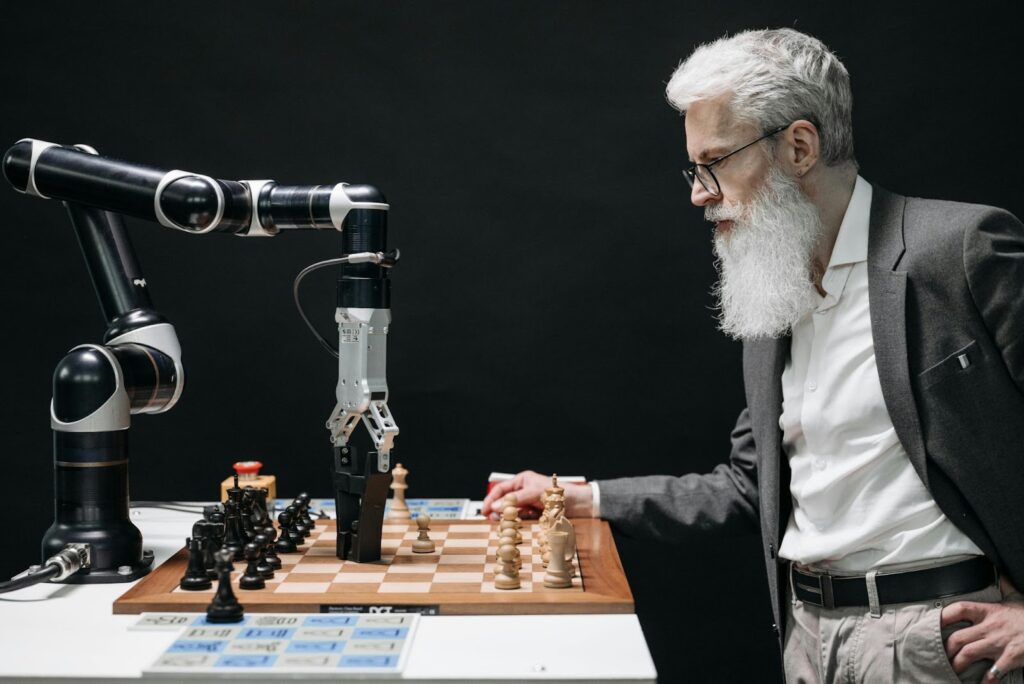 A man playing chess with a computer to show online education