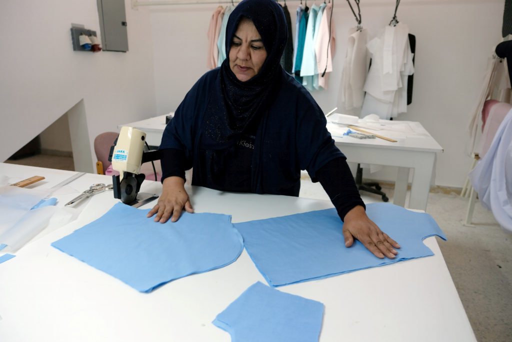 A woman works in a sewing workshop supervised by a charity to help widows, divorcees and needy in Benghazi, Libya on Sept....