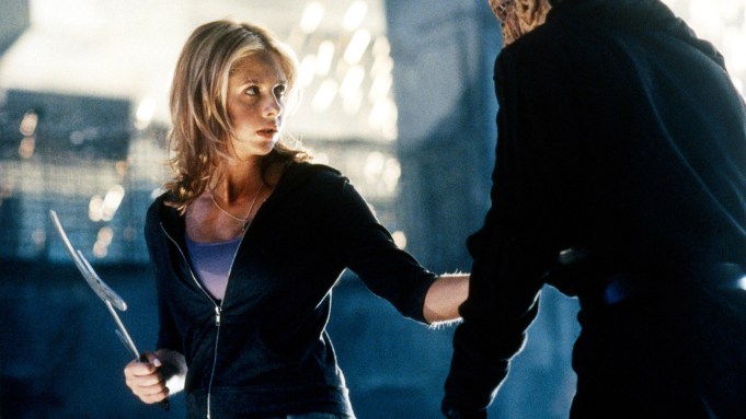 Sarah Michelle Gellar holds a weapon and squares off against a vampire in a still from 'Buffy the Vampire Slayer'.