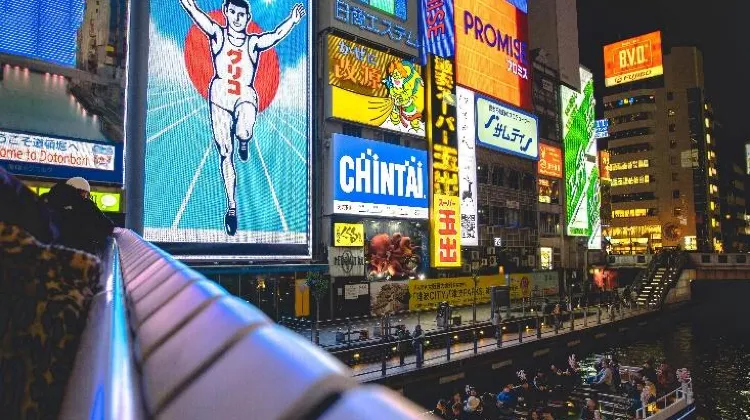 Source: Treddy Chen/ unsplash  The famous Dotonbori Glico Man has been standing here since 1935.