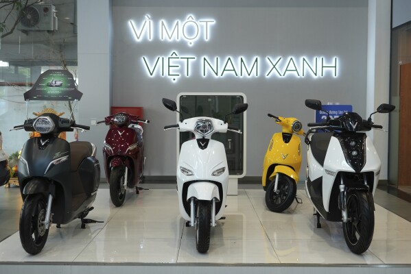 This photo shows Vinfast electric motorcycles displayed in a showroom in Hanoi, Vietnam, June 10, 2024. Vietnamese automaker VinFast just can’t sell enough cars, so it's hoping its tiniest and cheapest car yet — a roughly 10-foot-long mini-SUV priced at $9,200 and called the VF3 — will become Vietnam's “national car" and win over consumers in Asian markets. (AP Photo/Hau Dinh)