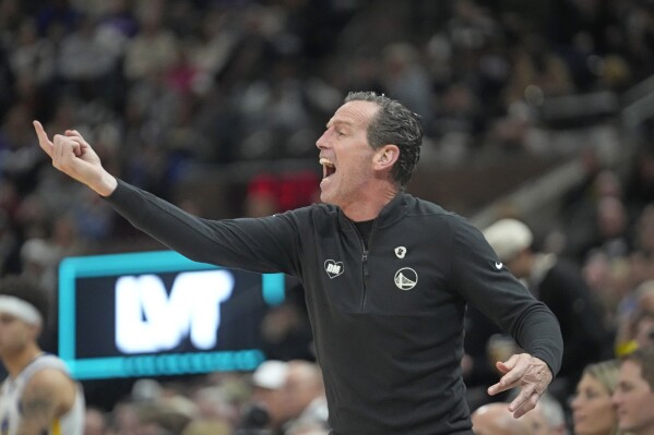 FILE - Golden State assistant coach Kenny Atkinson, serving as head coach, reacts during the second half of an NBA basketball game against the Utah Jazz, Monday, Feb. 12, 2024, in Salt Lake City.The Cleveland Cavaliers are hiring Golden State assistant Kenny Atkinson as their new coach, a person familiar with decision told the Associated Press on Monday, June 24. (AP Photo/Rick Bowmer, File)