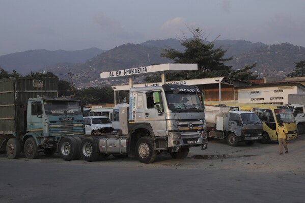 Parked vehicles and trucks are seen at a gas station as it runs without fuel in Bujumbura, Burundi, Thursday, June 6, 2024. Some businesses have invested in generators, but they struggle to find fuel to power them. Supply of petroleum products, especially gas, has sometimes been sporadic in Burundi since the beginning of 2024, causing disruptions to public transport and exposing motorists to high prices. (AP Photo/Berthier Muugirraaneza)