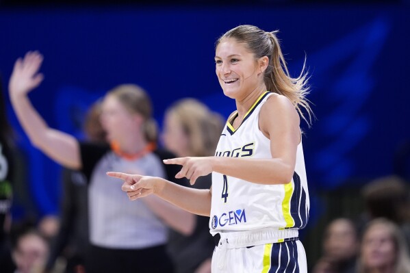 Dallas Wings' Jacy Sheldon (4) celebrates after sinking a three-point basket against the Minnesota Lynx in the second half of a WNBA basketball game in Arlington, Texas, Thursday, June 27, 2024. (AP Photo/Tony Gutierrez)