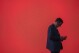 FILE - A visitor looks at his phone at the Mobile World Congress 2024 in Barcelona, Spain, Feb. 27, 2024. According to some un-scientific studies, the average person has hundreds of passwords to their name. (AP Photo/Pau Venteo, File)
